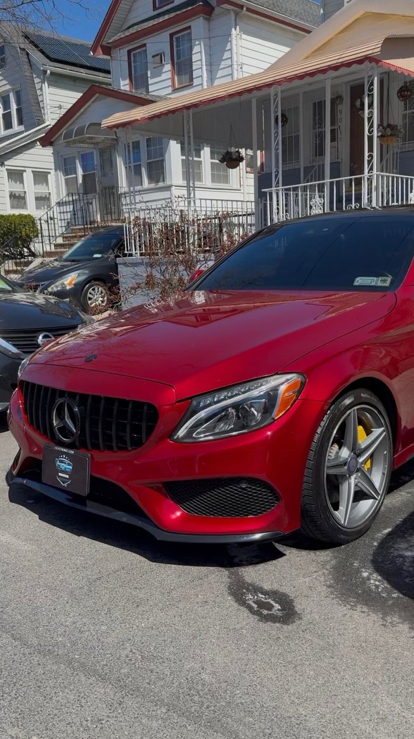 Red Mercedes-Benz sedan with a freshly detailed finish