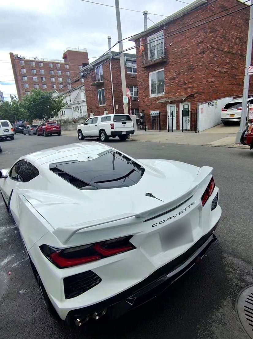 Rear view of a detailed white Chevrolet Corvette C8