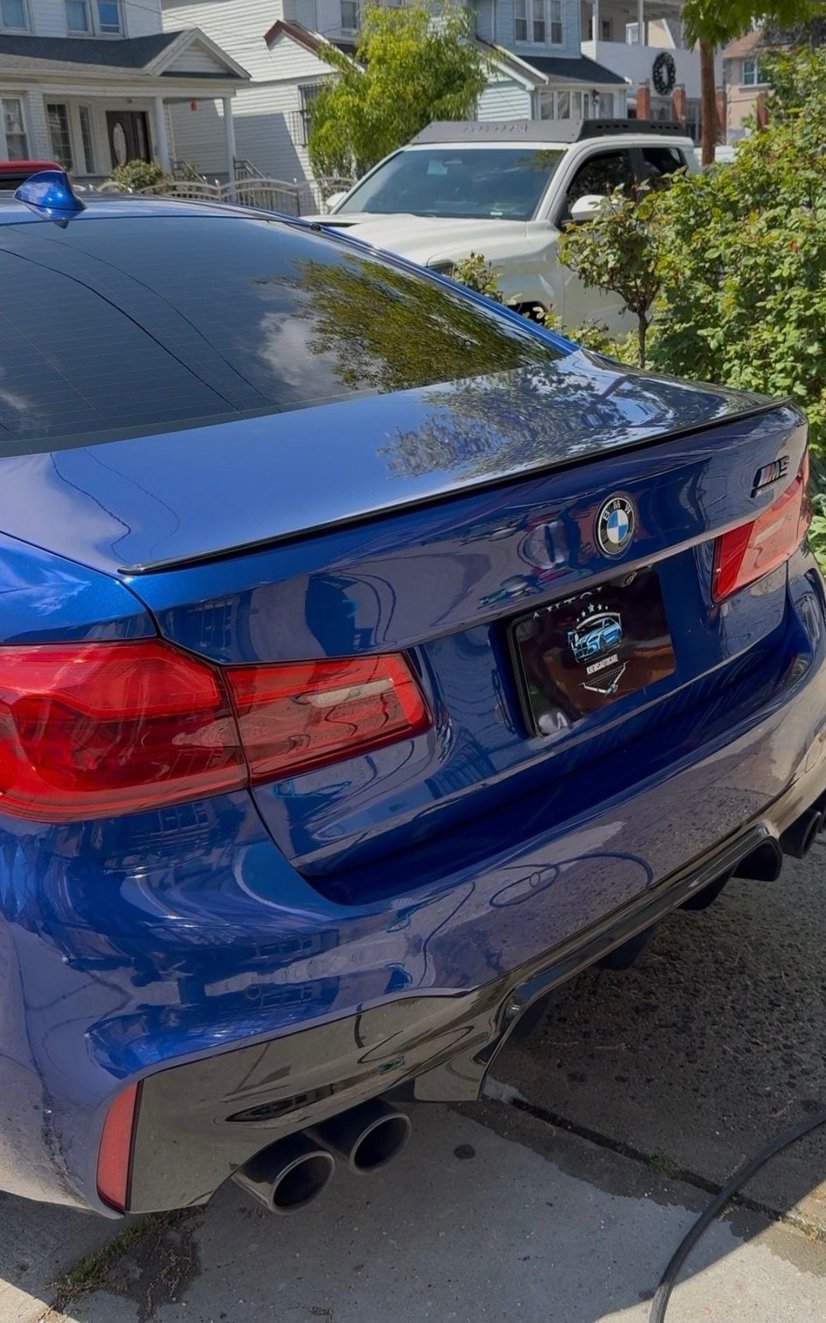 Rear view of a detailed blue BMW M5